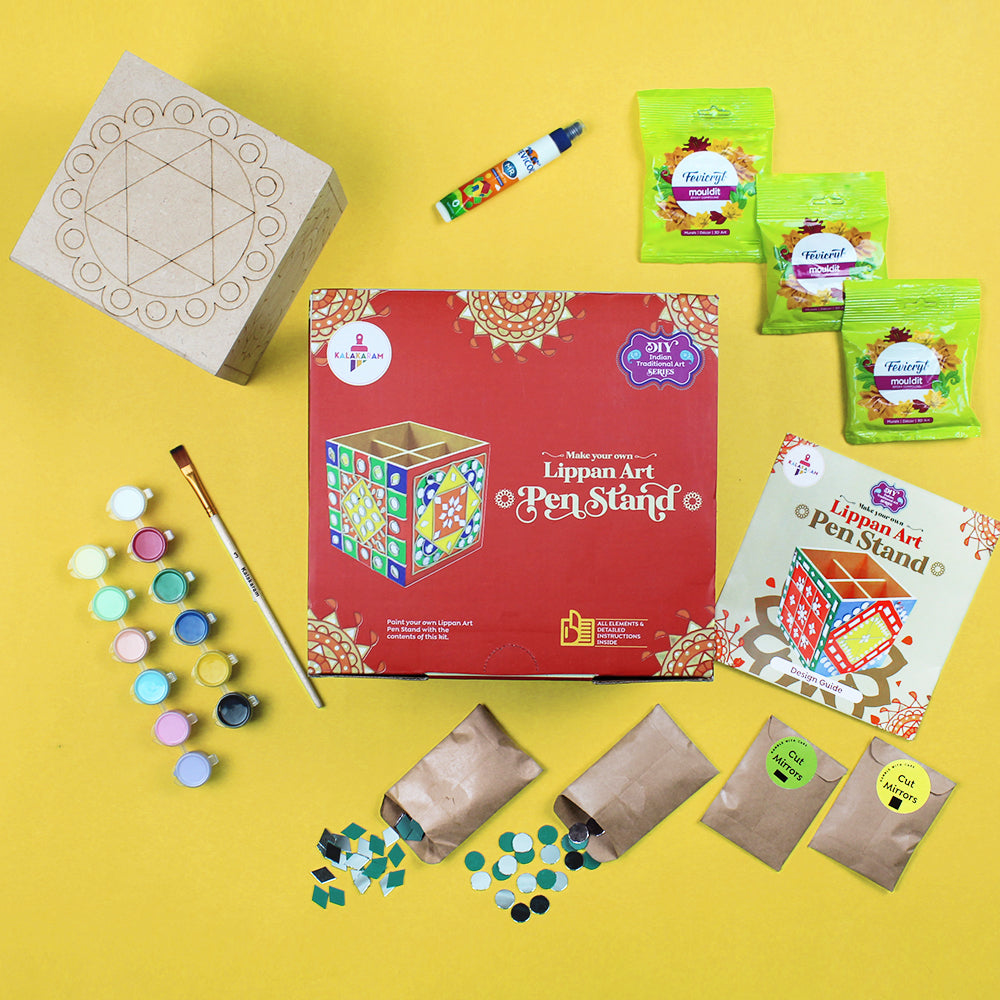 An all-inclusive Lippan Art pen stand kit displayed on a yellow background, including a pre-etched wooden pen stand, paint bottles, brushes, and decorative elements-Kalakaram
